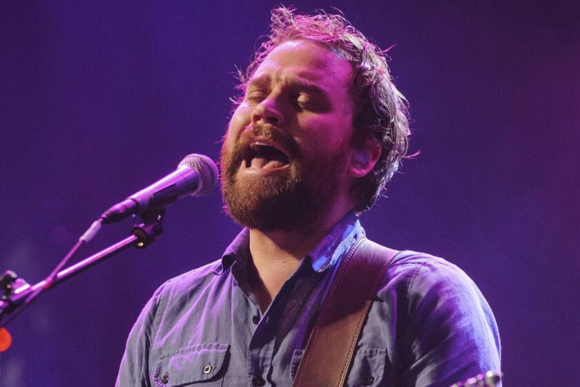 FILE - In this file photo dated Sept. 22, 2012, showing Scott Hutchison, frontman singer of Scottish rock band Frightened Rabbit. Hutchison went missing Wednesday, and police say Friday May 11, 2018, they have found a body, with formal identification expected soon. (Dominic Lipinski/PA FILE via AP)