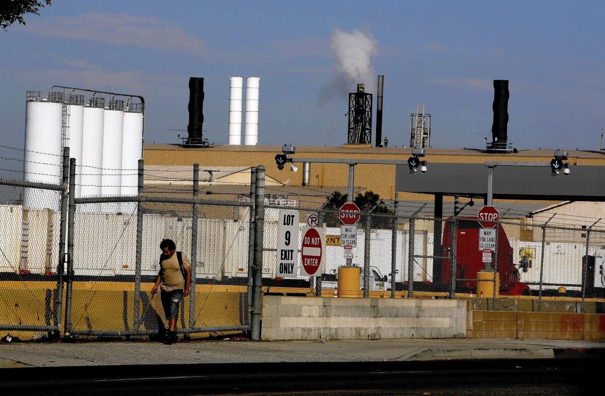 One year after the South Coast Air Quality Management District found that arsenic emissions from the Exide plant posed a cancer risk to more than 100,000 people, the agency has approved the company's plan to reduce health risks.