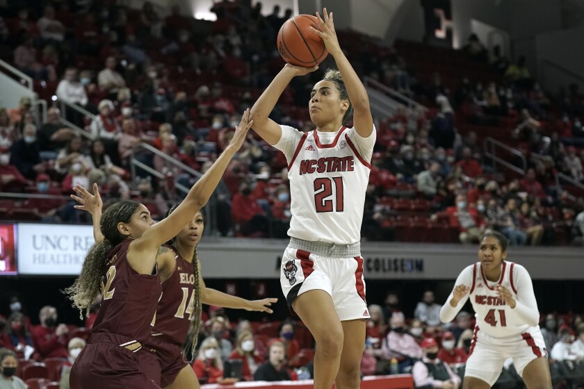 North Carolina State guard Madison Hayes (21) shoots against Elon guard Vanessa Taylor during the first half of an NCAA college basketball game in Raleigh, N.C., Sunday, Dec. 5, 2021. (AP Photo/Gerry Broome)