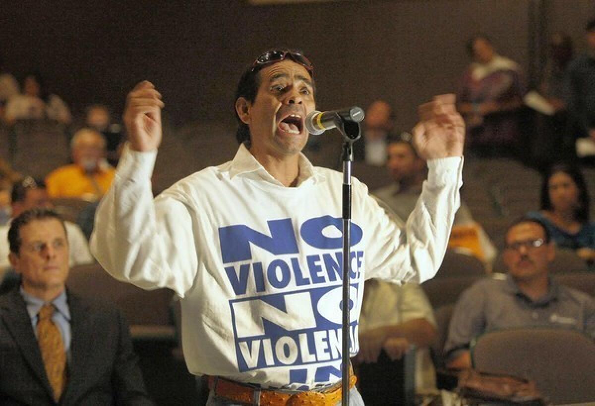 Seferino Garcia makes his point during an Anaheim City Council forum on police shootings, which have sparked protests.