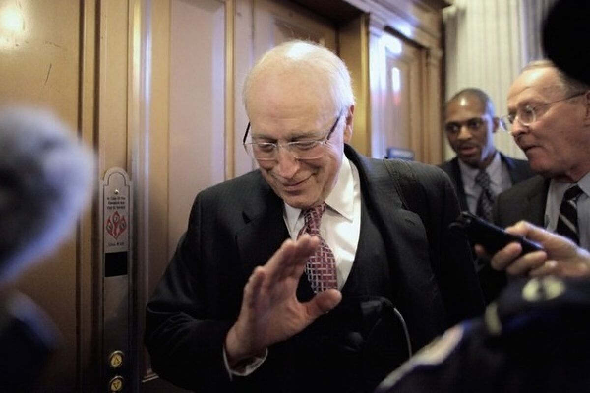 Former Vice President Dick Cheney dodges reporters' questions as he leaves the Senate Republican policy luncheon at the Capitol on Nov. 29.