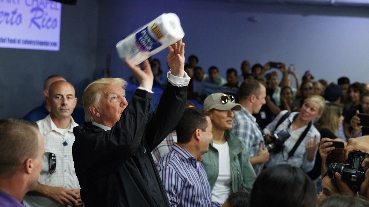 President Trump tosses paper towels into a crowd of Puerto Ricans during a visit to the storm-ravaged island of more than 3 million Americans on Oct. 3, two weeks after it was hit by Hurricane Maria on the heels of Hurricane Irma.