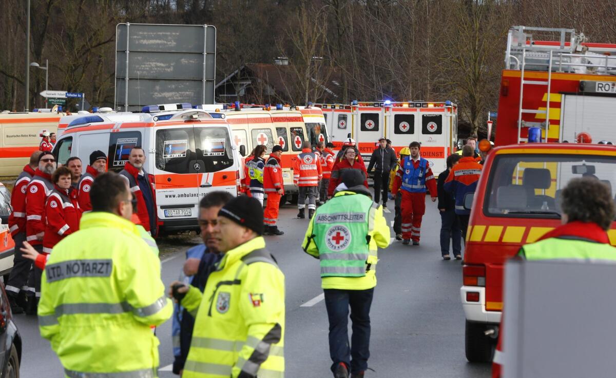 Rescue personnel wait in Bad Aibling, Germany, after a fatal train crash Feb. 9.