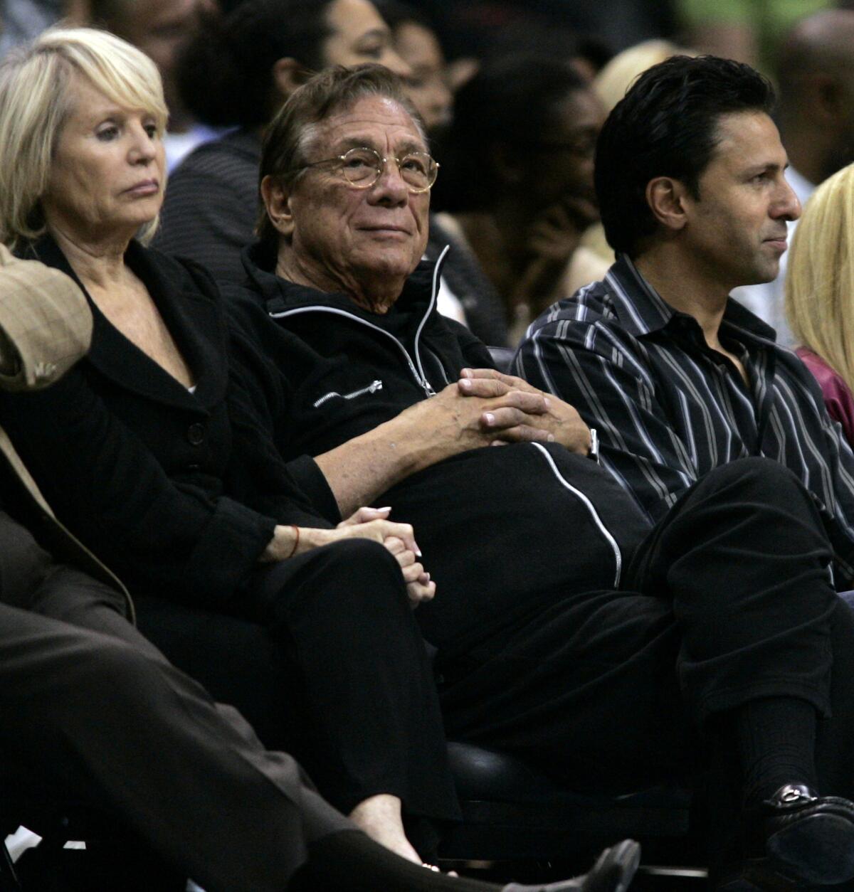 Rochelle Sterling (left) watches a preseason Clippers game in 2008 with her husband, Donald (center). Not shown: V Stiviano.