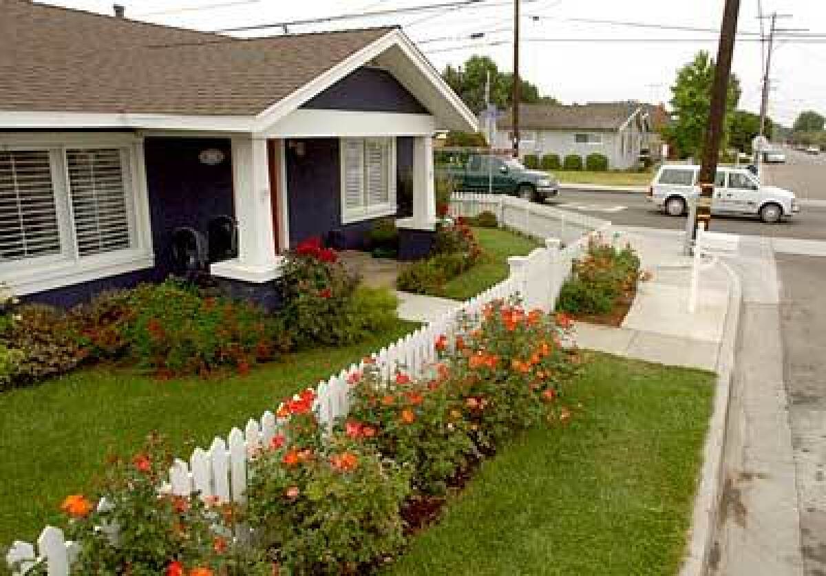 The front porch and white picket fence are emblematic of the east side of Costa Mesa, where families reign.