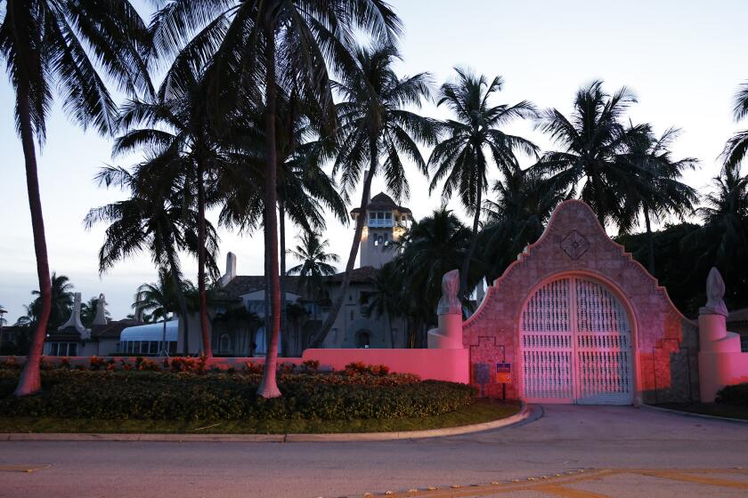 The entrance to former President Donald Trump's Mar-a-Lago estate is shown, Monday, Aug. 8, 2022, in Palm Beach, Fla. Trump said in a lengthy statement that the FBI was conducting a search of his Mar-a-Lago estate and asserted that agents had broken open a safe. (AP Photo/Terry Renna)