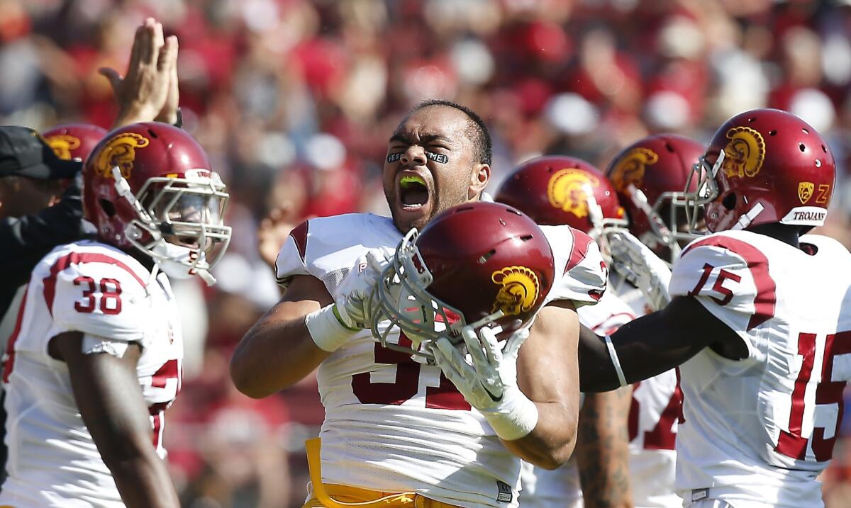 USC fullback Soma Vainuku screams out in excitement following a win over Stanford in 2014.
