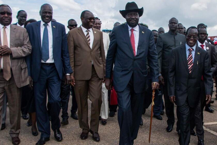 South Sudan's President Salva Kiir (2nd L) arrives at Juba International Airport in Juba on June 22, 2018. Kiir returned from Ethiopia's capital Addis Ababa after a face-to-face meeting with the opposition leader Riek Machar for the first time in almost two years on efforts to end a five-year civil war. / AFP PHOTO / Akuot CholAKUOT CHOL/AFP/Getty Images ** OUTS - ELSENT, FPG, CM - OUTS * NM, PH, VA if sourced by CT, LA or MoD **