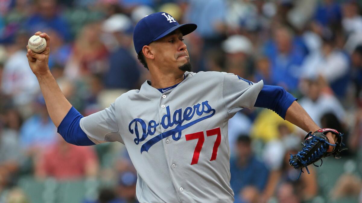 Dodgers starter Carlos Frias delivers a pitch during a game against the Chicago Cubs on June 25.