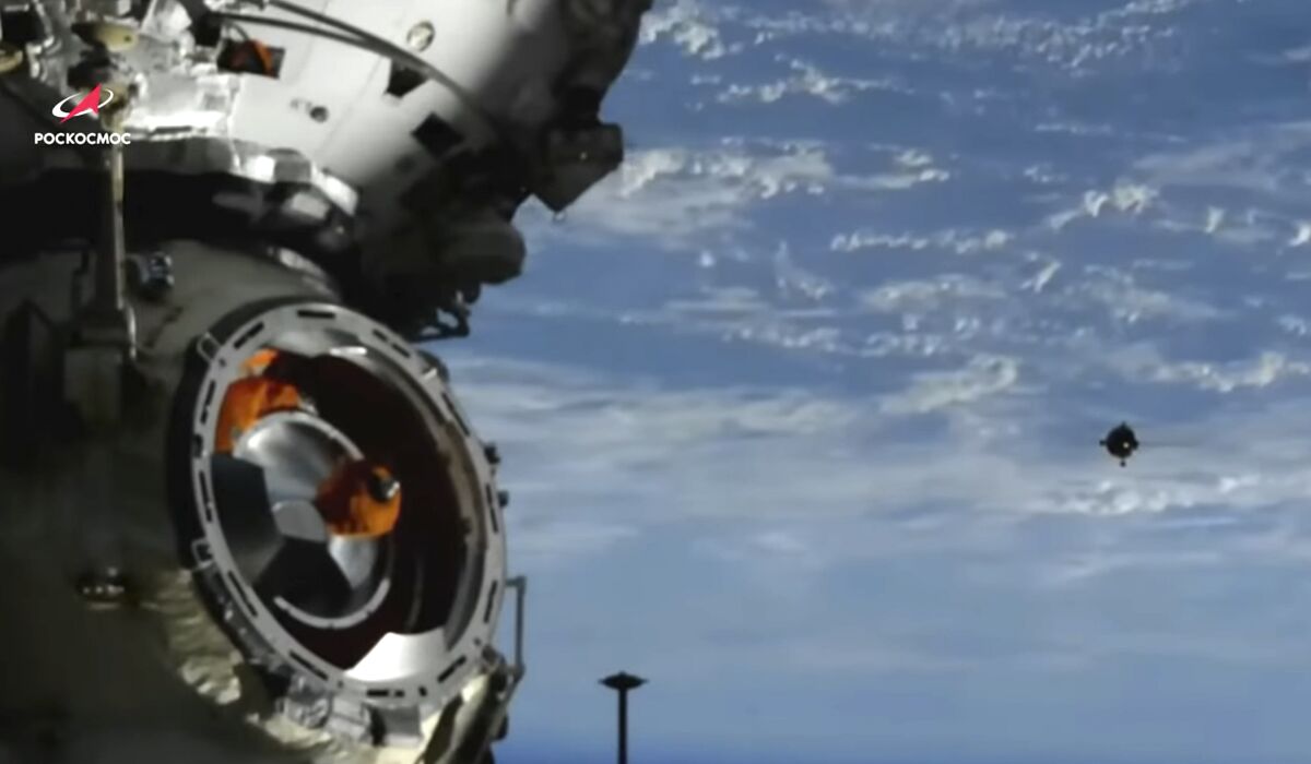 FILE - In this image taken from video footage released by the Roscosmos Space Agency, the Soyuz MS-21 space ship, right, approaches the International Space Station, ISS, during docking to the station, Friday, March 18, 2022. The head of Russia’s space program says the future of the International Space Station hangs in the balance after the United States, the European Union and Canadian space agencies missed a deadline to meet Russian demands for lifting sanctions on Russian enterprises and hardware. (Roscosmos Space Agency via AP, File)