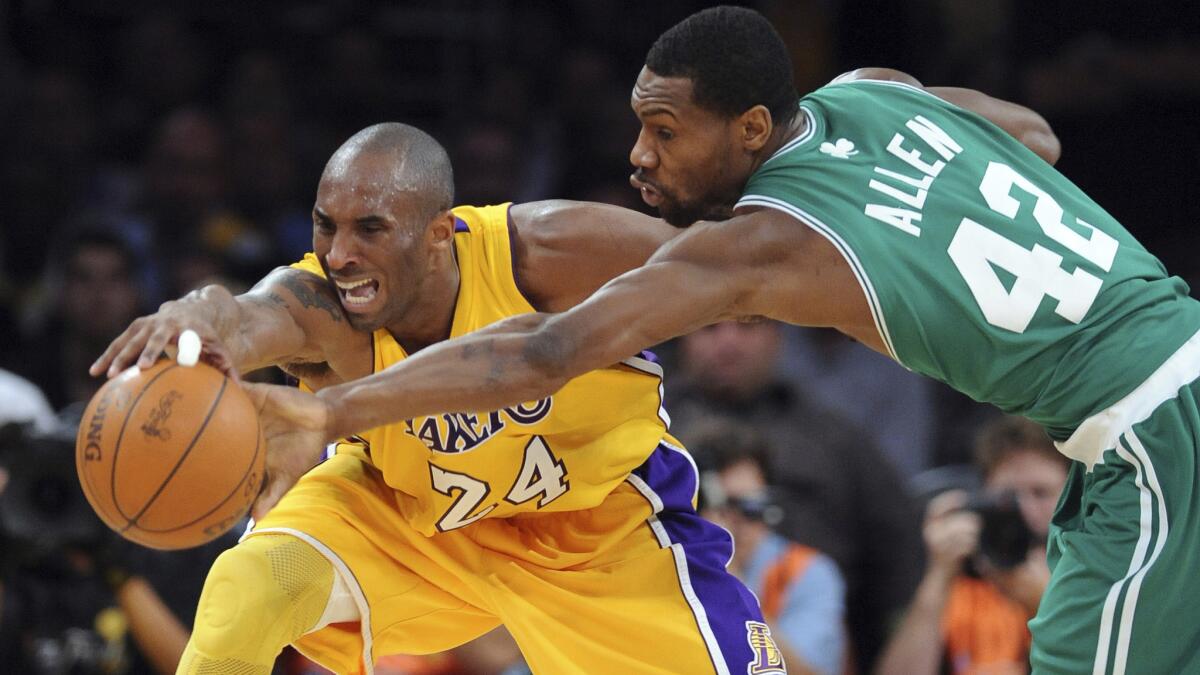 Lakers star Kobe Bryant and Celtics guard Tony Allen battle for a loose ball during Game 6 of the 2010 NBA Finals at Staples Center.