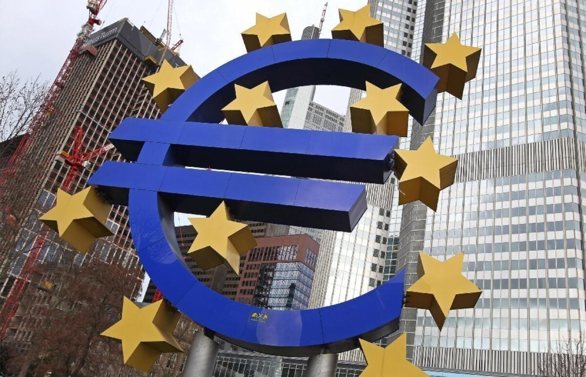 The euro logo is incorporated in a sculpture in front of the European Central Bank in Frankfurt, Germany.
