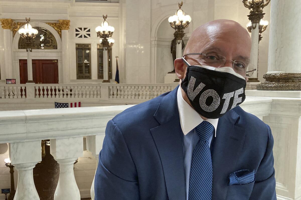 Pennsylvania state Sen. Vince Hughes, D-Philadelphia, poses in the Rotunda of the state Capitol in Harrisburg, Pa on Wednesday May 21, 2021. State voters next week will decide whether to add a racial equality provision to the state constitution, a measure Hughes introduced last year, two weeks after George Floyd was killed by police in Minneapolis. (AP Photo/Mark Scolforo)