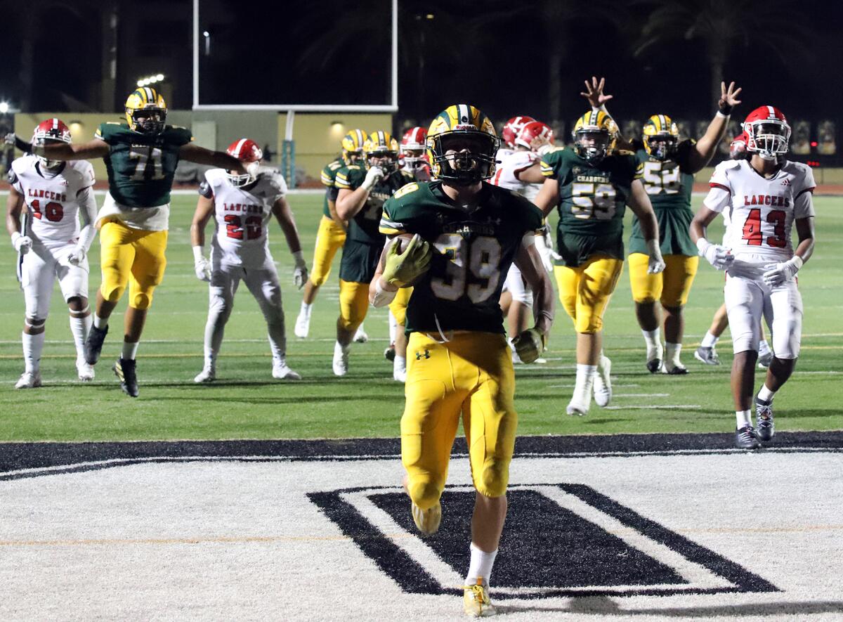 Edison running back Carter Hogue (39) scores in the fourth quarter during the Chargers' win over Orange Lutheran on Friday.