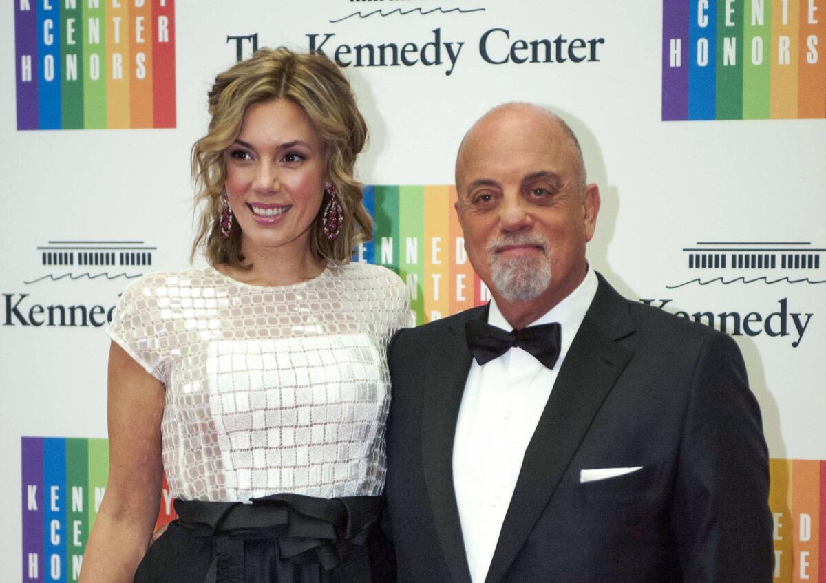 Billy Joel and Alexis Roderick arrive at the Kennedy Center Honors gala dinner in Washington on Dec. 7, 2013.