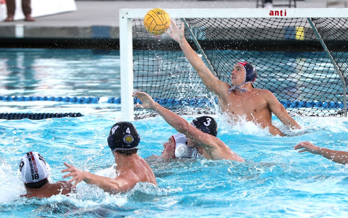Newport Harbor goalkeeper Cooper Mathisrud makes a save in Wednesday's match.