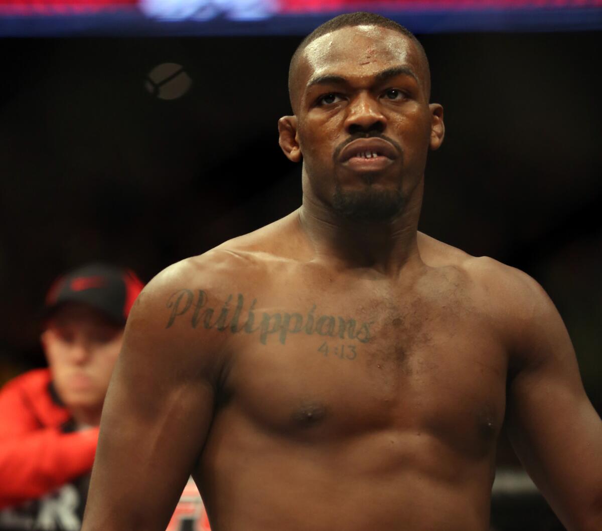 Jon Jones is seen in the ring before his UFC bout in April 2013. Jones is hoping to quiet his critics with a strong performance Saturday against Glover Teixeira.