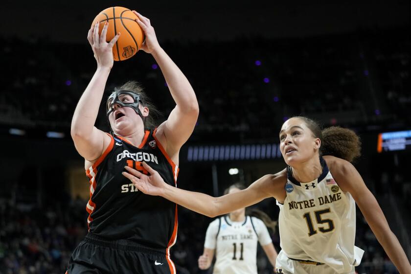 Oregon State forward Raegan Beers (15) shoots against Notre Dame forward Natalija Marshall (15) during the second quarter of a Sweet Sixteen round college basketball game during the NCAA Tournament, Friday, March 29, 2024, in Albany, N.Y. (AP Photo/Mary Altaffer)