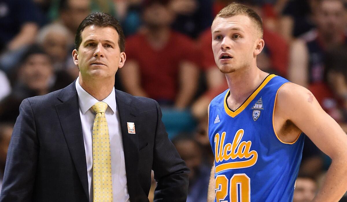 UCLA Coach Steve Alford talks with son Bryce Alford during a Pac-12 semifinal game against the Arizona Wildcats at the MGM Grand Garden Arena on Friday.