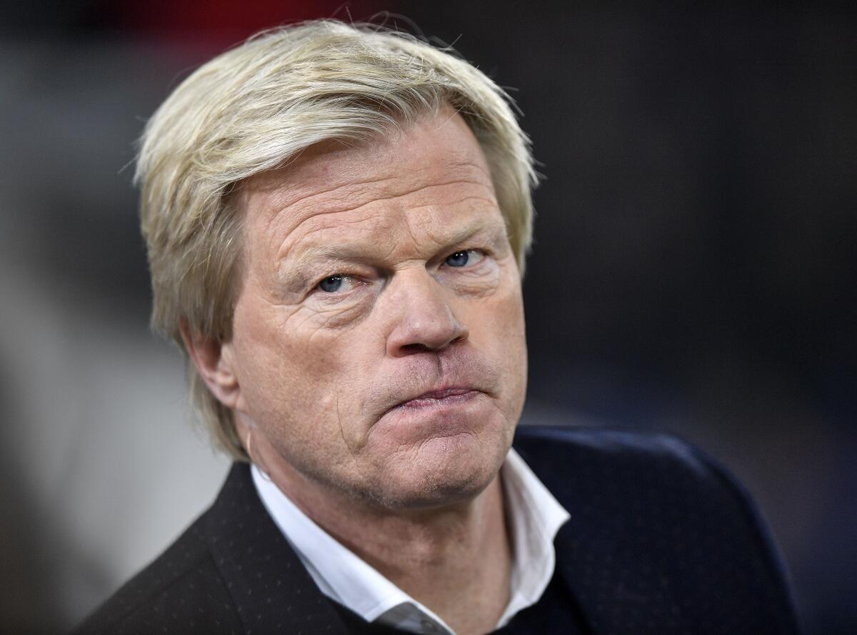 FILE --Bayern Munich board member and TV expert Oliver Kahn watches prior the German Bundesliga soccer match between FC Schalke 04 and Borussia Moenchengladbach at the Arena in Gelsenkirchen, Germany, Friday, Jan. 17, 2020. (AP Photo/Martin Meissner,file)