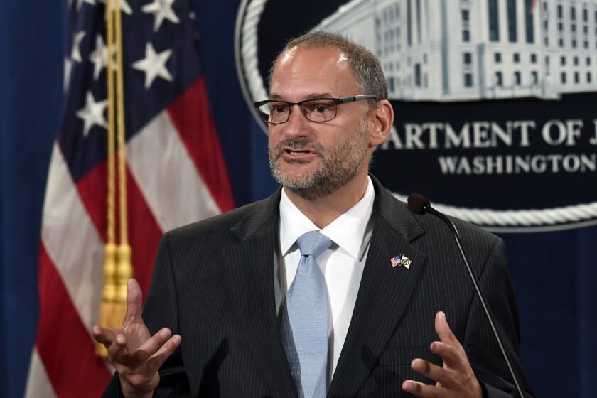 U.S. prisons chief Hugh Hurwitz speaks during a news conference at the Justice Department in Washington, D.C., on July 19.
