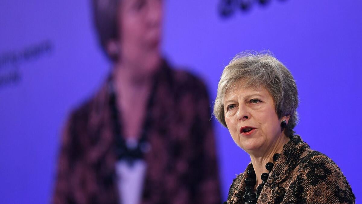British Prime Minister Theresa May defends her Brexit deal at a business conference in London on Monday.