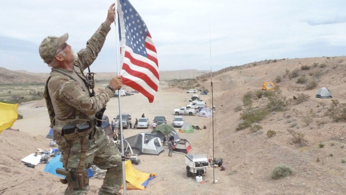 In 2014, Jerry DeLemus of Rochester N.H., joins supporters of rancher Cliven Bundy in a standoff with federal officials near Bunkerville, Nev.
