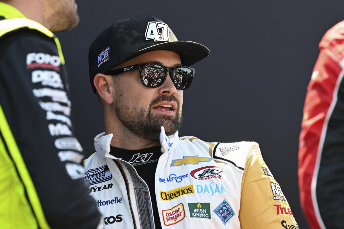 FILE - Driver Ricky Stenhouse Jr. looks on prior to a NASCAR Cup Series auto race at Darlington Raceway, Sunday, May 12, 2024, in Darlington, S.C. Stenhouse Jr. was fined $75,000 by NASCAR on Wednesday, May 22, for fighting with Kyle Busch after the All-Star race at North Wilkesboro Speedway. (AP Photo/Matt Kelley, File)