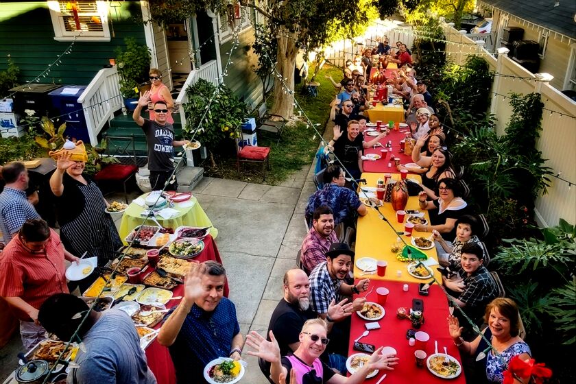 People gather at Noelle Carter's Southern California home for her annual 'Long Table' Thanksgiving dinner on Nov. 23, 2017.