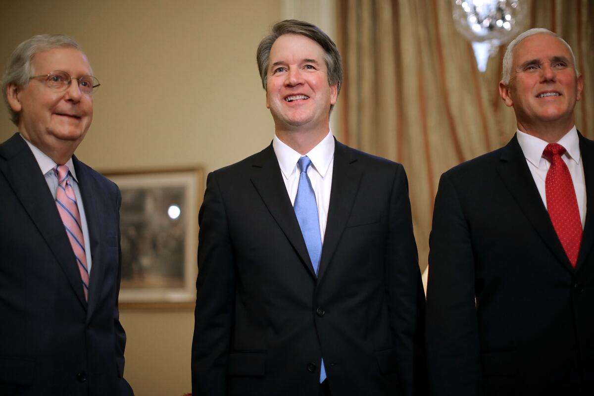 Senate Majority Leader Mitch McConnell (R-Ky.), left, Judge Brett Kavanaugh and Vice President Mike Pence at the U.S. Capitol on Tuesday.