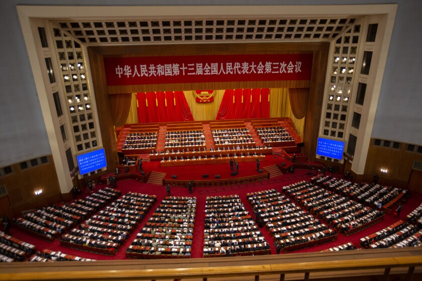 FILE - Delegates and Chinese leaders attend the closing session of China's National People's Congress (NPC) in Beijing on May 28, 2020. China's 3,000-member ceremonial parliament will open its annual session Saturday, March 5, 2022 with the government facing a slowing economy and international pressure over its stance on Russia's invasion of Ukraine. (AP Photo/Mark Schiefelbein, File)