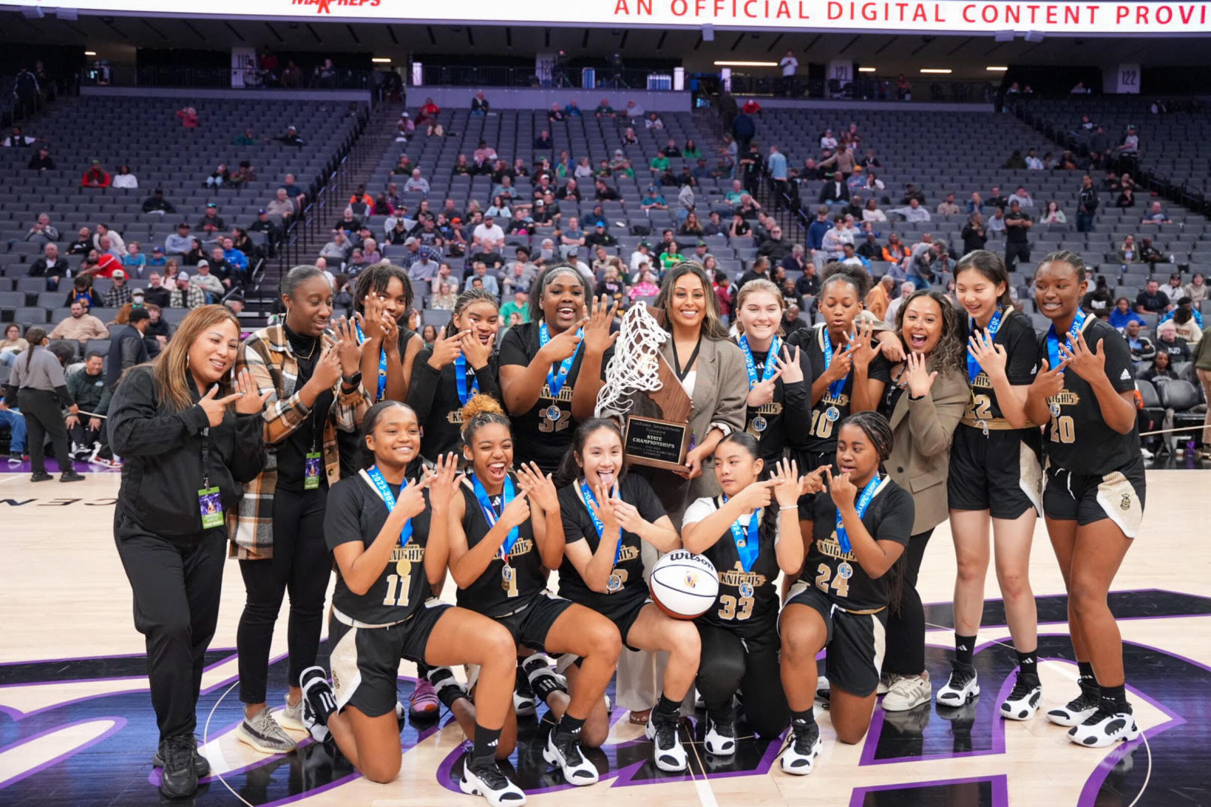 Bishop Montgomery players and coaches celebrate after winning the state Division I girls' title.