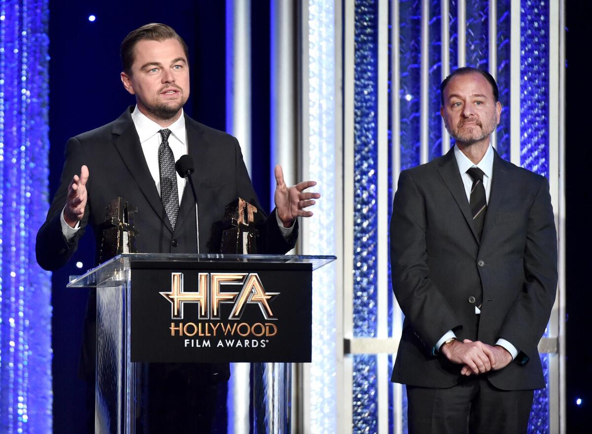 Producer Leonardo DiCaprio, left, and director Fisher Stevens, recipients of the Hollywood Documentary Award for "Before the Flood."