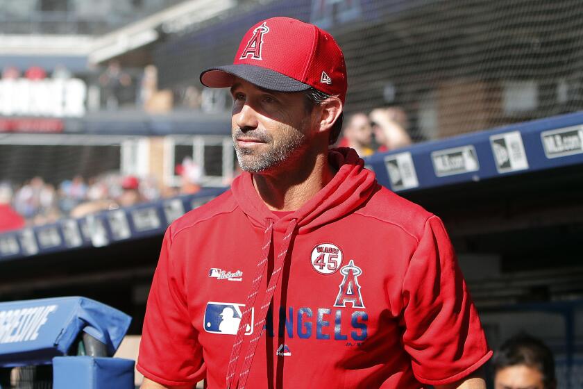 CLEVELAND, OH - AUGUST 03: Manager Brad Ausmus #12 of the Los Angeles Angels of Anaheim walks from the dugout before the game against the Cleveland Indians at Progressive Field on August 3, 2019 in Cleveland, Ohio. The Indians defeated the Angels 7-2. (Photo by David Maxwell/Getty Images)