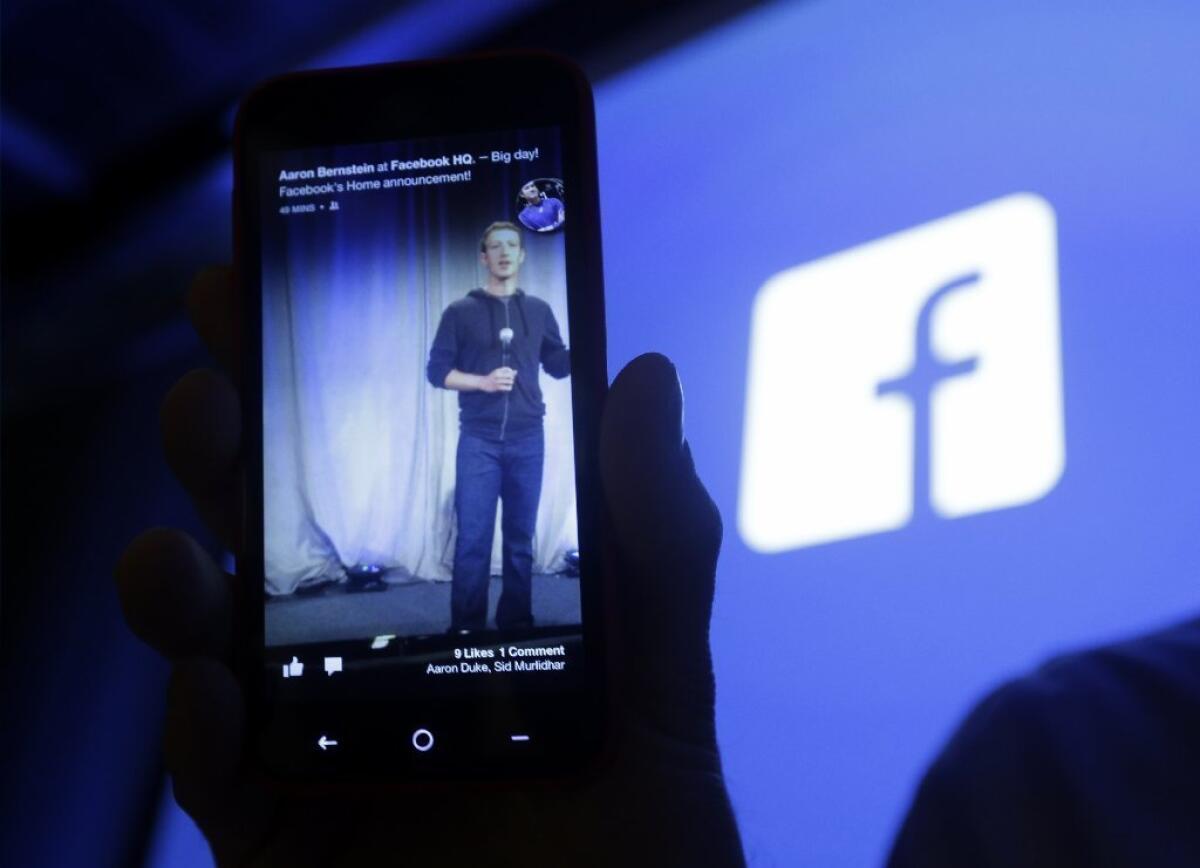 A presentation by Facebook CEO Mark Zuckerberg is displayed on a smartphone.