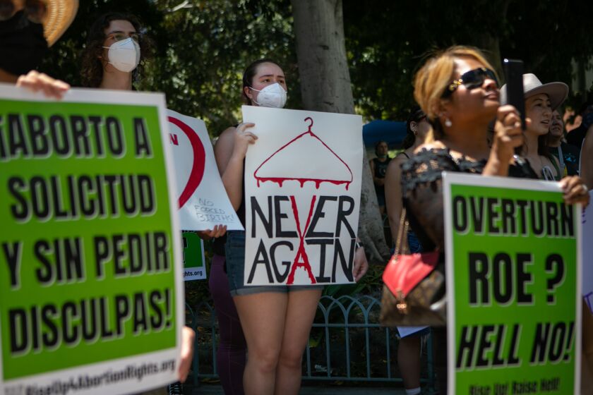 LOS ANGELES, CA - JUNE 26: Protesters gather in Grand Park at a rally organized by The Feminist Front and Generation Ratify protesting the U.S. Supreme Court's decision to overturn federal abortion protections provided under Roe v. Wade on Sunday, June 26, 2022 in Los Angeles, CA. (Jason Armond / Los Angeles Times)