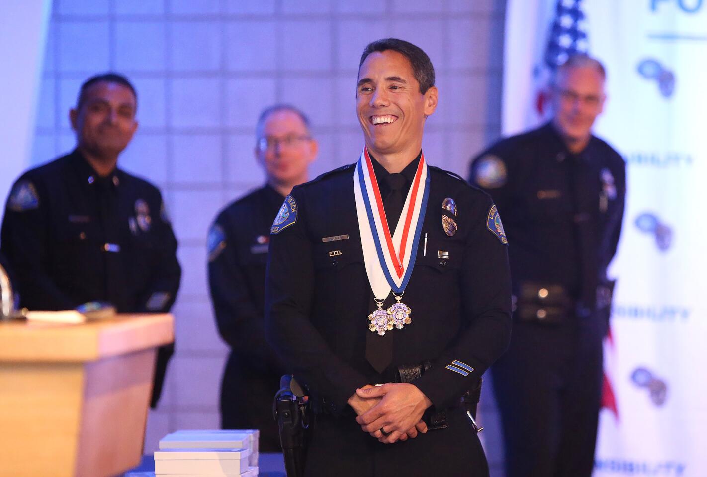 Officer Michael Short receives the 2018 Officer of the Year award during the 32nd Laguna Beach Police Employee Recognition Ceremony presented by the Laguna Beach Exchange Club on Thursday at Seven-degrees. Short has had several positions in the department over the past 14 years, including the summer beach patrol team, records specialist, patrol officer, drone, social media and crime scene team member, and is now the department’s training officer, responsible for hiring, training and mentoring new recruits.