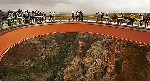 VIPs, members of the media and the Hualapai tribe take a preview walk on the Skywalk, billed as the first-ever cantilever-shaped glass walkway extending 70 feet from the western Grand Canyon's rim.
