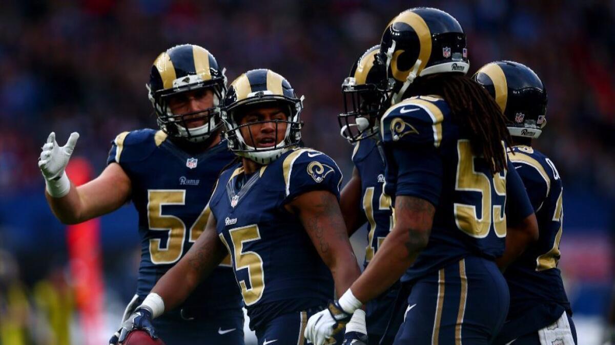 Rams receiver Bradley Marquez (15) celebrates with his teammates during a game against the New york Giants in London on Oct. 23.