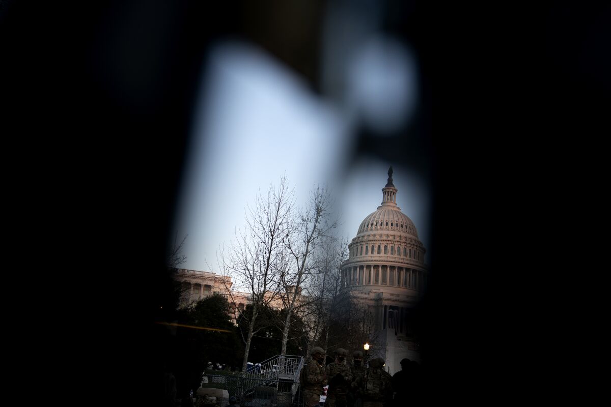 The U.S. Capitol is seen through additional security fencing on Jan. 12, 2021 in Washington, DC.