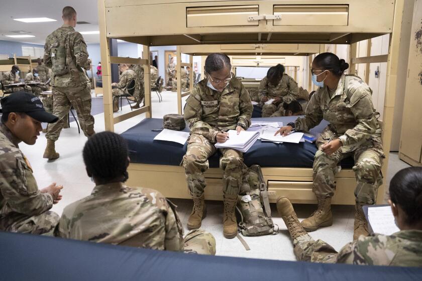 Students enlisted in the new Army prep course work together in barracks at Fort Jackson in Columbia, S.C., Friday, Aug. 26, 2022. The new course is an an effort to better prepare recruits for the demands of basic training. (AP Photo/Sean Rayford)