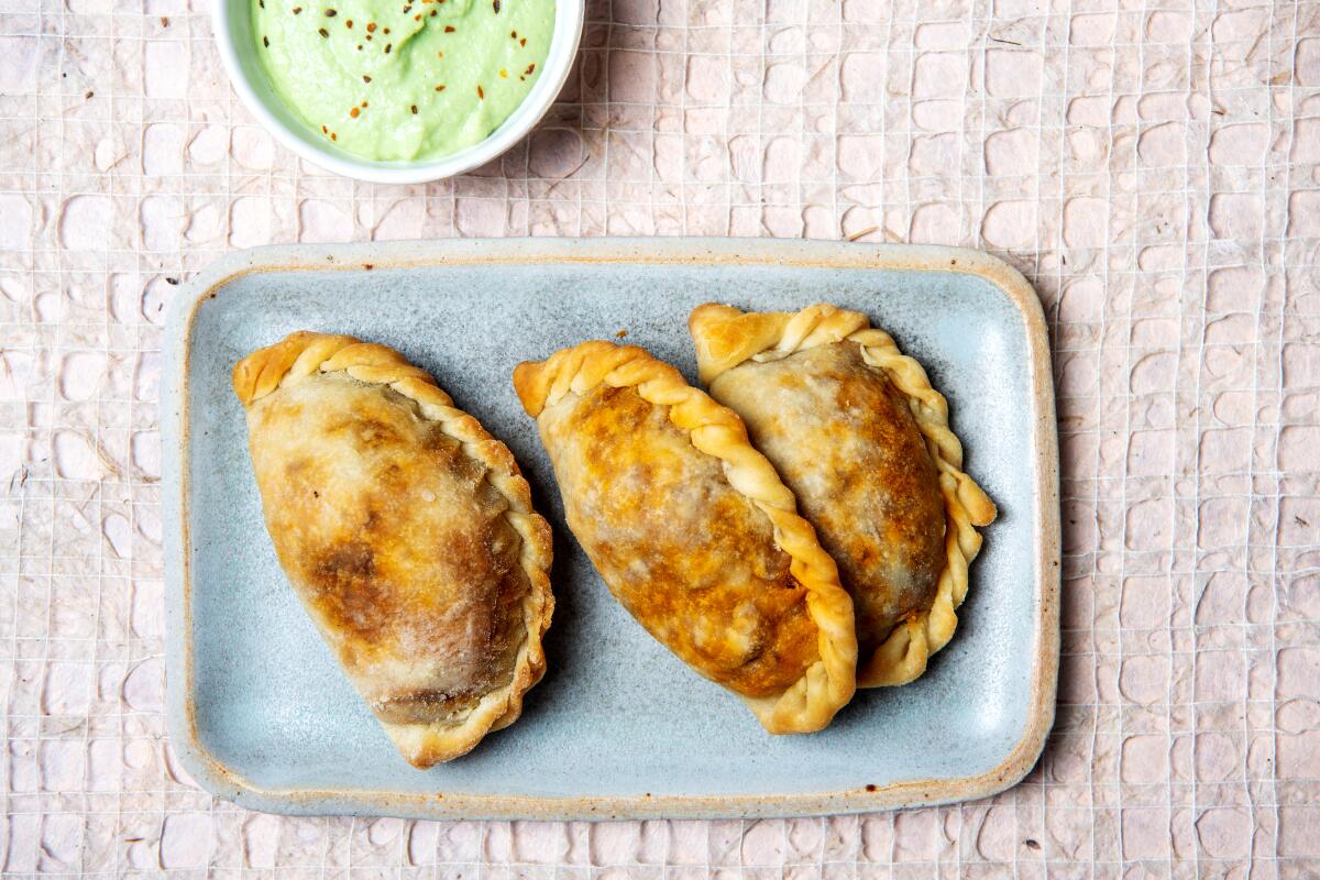 A tray of picadillo empanadas.