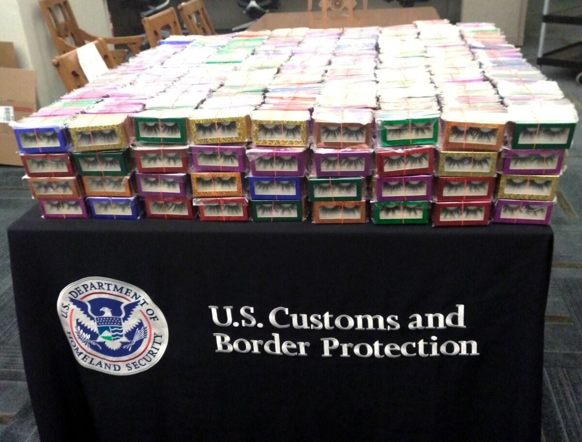 This photo provided by U.S. Customs and Border Protection shows boxes of long lashes seized Tuesday, July 6, 2021 at Louis Armstrong New Orleans International Airport. Three thousand pairs of false eyelashes have been seized by U.S. Customs and Border Protection agents after officials determined they were illegally imported from China to New Orleans. Agency spokesperson Matthew Dyman tells WVUE-TV that the four boxes of long lashes seized Tuesday were destined for a local beauty supply store.(U.S. Customs and Border Protection via AP)