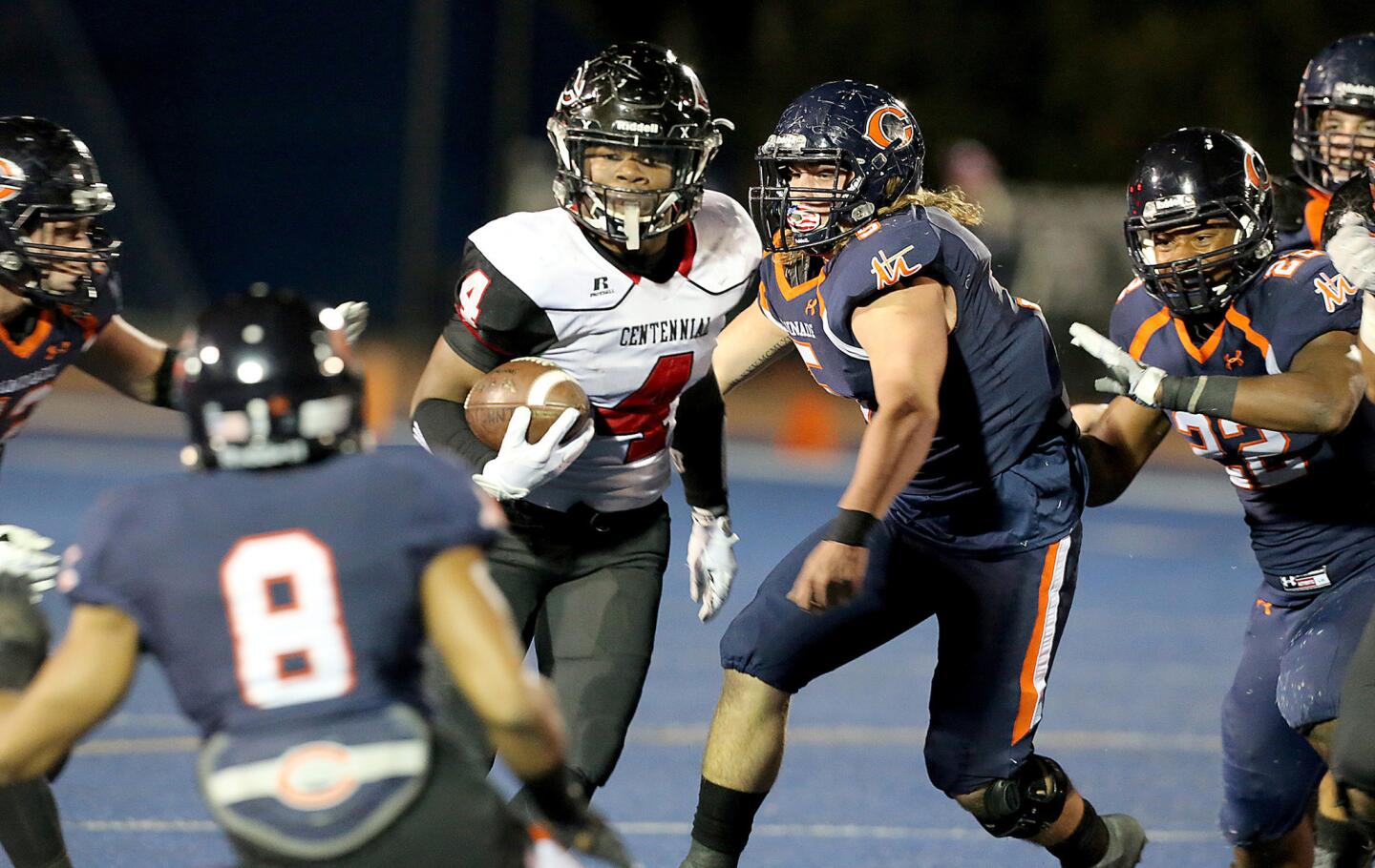 Centennial running back Miles Reed slashes through the Chaminade defense during the first half of a game on Nov. 18.