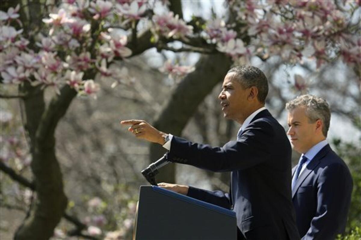 President Obama, accompanied by acting Budget Director Jeffrey Zients, discusses his proposed fiscal 2014 federal budget in a Rose Garden news conference.