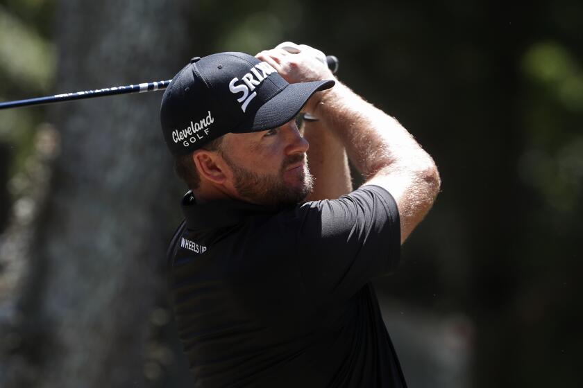 Graeme McDowell of Northern Ireland, hits from the 16th tee, during the first round of the RBC Heritage golf tournament, Thursday, June 18, 2020, in Hilton Head Island, S.C. (AP Photo/Gerry Broome)