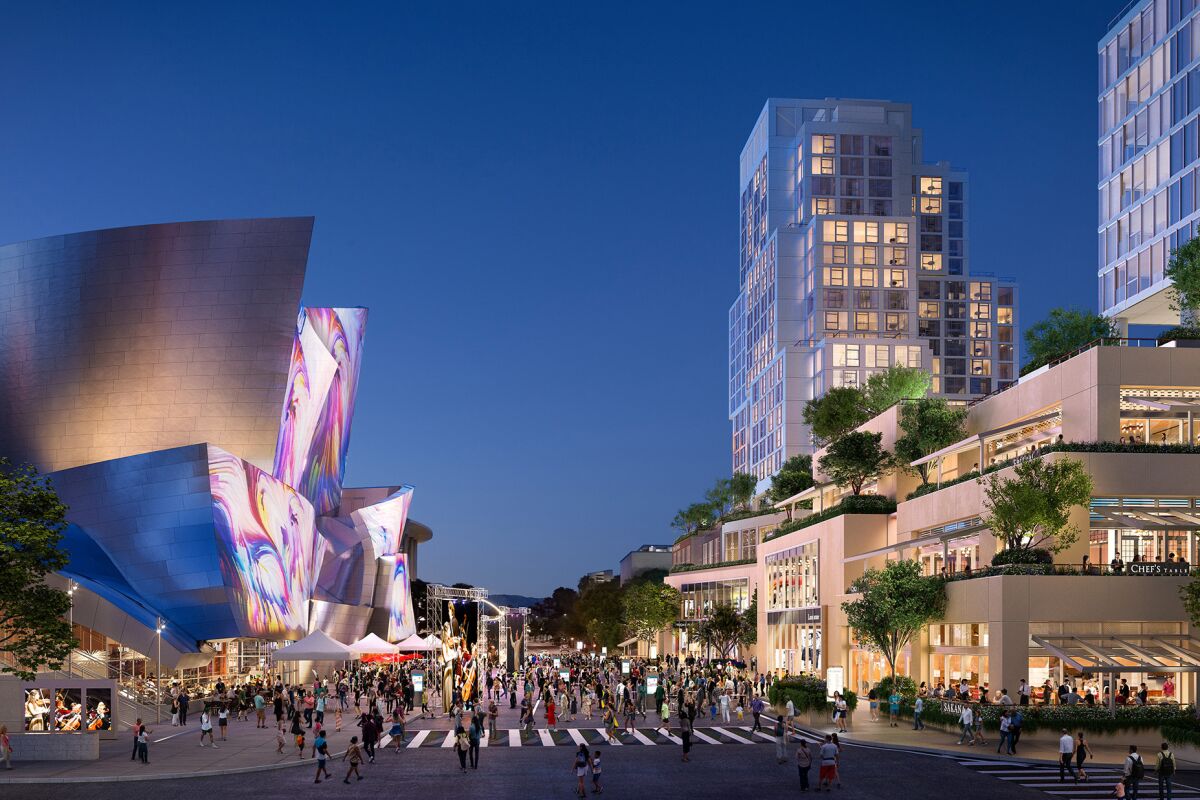 People in the street between Walt Disney Concert Hall and the Conrad hotel.