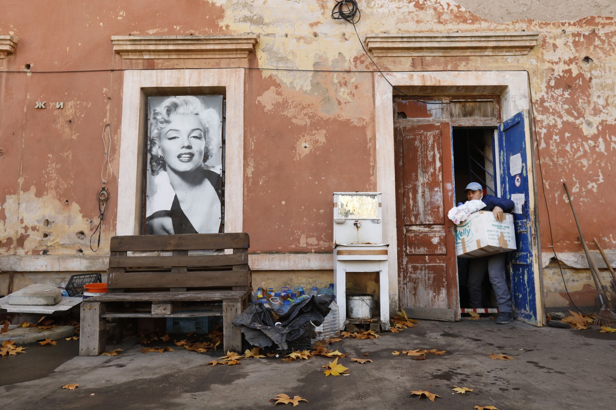 A man carries donated supplies from one of eight aid centers in Mykolaiv.