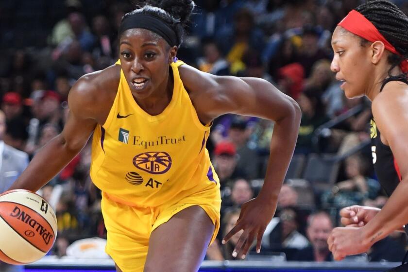 LAS VEGAS, NEVADA - MAY 26: Chiney Ogwumike #13 of the Los Angeles Sparks drives against A'ja Wilson #22 of the Las Vegas Aces during their game at the Mandalay Bay Events Center on May 26, 2019 in Las Vegas, Nevada. The Aces defeated the Sparks 83-70. NOTE TO USER: User expressly acknowledges and agrees that, by downloading and or using this photograph, User is consenting to the terms and conditions of the Getty Images License Agreement. (Photo by Ethan Miller/Getty Images ) ** OUTS - ELSENT, FPG, CM - OUTS * NM, PH, VA if sourced by CT, LA or MoD **