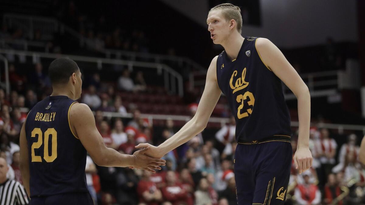 California guard Matt Bradley (20) celebrates with center Connor Vanover (23) during the first half against Stanford on Thursday.